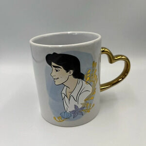 Disney Prince Eric-The Little Mermaid gold heart handle coffee mug. Preowned.